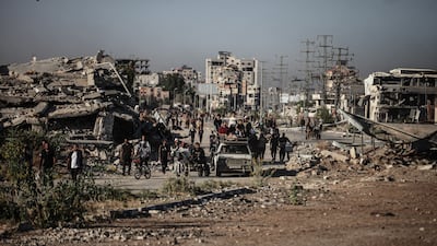 Palestinians carry their belongings along Salah Al Din Road, the main north-south route in Gaza. AFP
