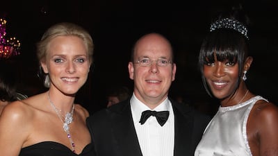 Charlene Wittstock, in a black strapless dress, with Prince Albert II of Monaco and Naomi Campbell, attends the Unite For A Better World Gala Dinner, in Monte Carlo on September 2, 2007. Getty Images