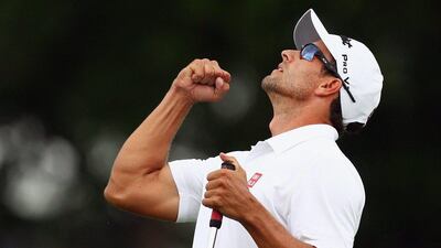 Adam Scott celebrates a birdie putt on the thrid play-off hole to defeat Jason Dufner and win the Crowne Plaza Invitational at Colonial on Sunday. Marianna Massey / Getty Images / AFP / May 25, 2014