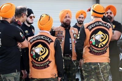 Gurnam Singh (centre) briefing the riders. Photo: Pawan Singh / The National