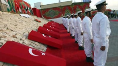 Hamas naval police personnel hold a ceremony in the Gaza City port for the nine people killed during Israel's raid on an aid flotilla.