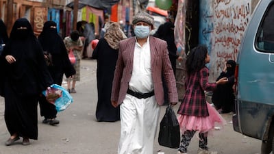 A Yemeni wears a protective face mask amid the ongoing coronavirus Covid-19 pandemic in Sanaa, Yemen. EPA