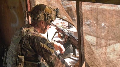 US Army 2nd Lt Landon Montoya of the 1st Stryker Brigade Combat Team, 25th Infantry Division observes the street outside the US Embassy in Iraq in Baghdad. EPA