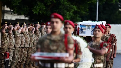 Lebanese Army soldiers carry the coffin of Maj Mohammad Farhat during an official ceremony to pay tribute in Beirut, Lebanon. Reuters