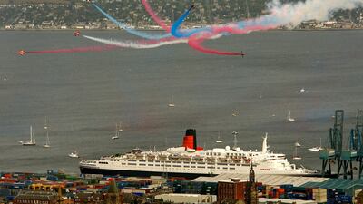 The Red Arrows fly past the QE2 as it sits berthed at Ocean Terminal in Greenock, Scotland, in September 2007. Getty Images