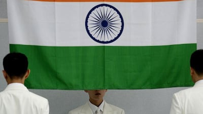 The Indian national flag gets raised at the medal ceremony for the men's 50 metre pistol, the event Jitu Rai took gold in, at the 2014 Asian Games. Manan Vatsayana / AFP / September 20, 2014