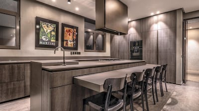 Gaggenau appliances adorn the kitchen, which has bespoke counters and cabinetry.