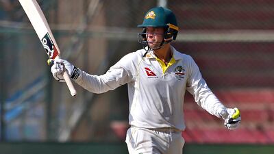 Australia's Alex Carey celebrates reaching his half century. AP