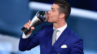 Cristiano Ronaldo kisses his trophy after winning the The Best Fifa Men’s Player of 2016 Award on January 9, 2017 in Zurich. Fabrice Coffrini / AFP