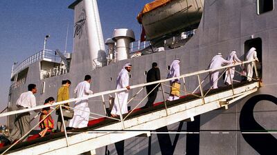 Passengers board a ferry service to Iraq on November 7, 1998 from Port Rashid. At the time, it was the first direct link between the Gulf and its sanctions-hit neighbour since the 1990 war. Kamran Jebreili / AP Photo