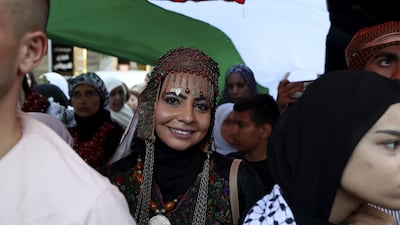 Women in the West Bank city of Ramallah celebrate Traditional Dress Day, an annual heritage event representing Palestinian costume, crafts such as embroidery, and song. AFP