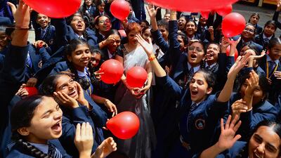 Indian school children and teachers take part in Teachers' Day celebrations at Sri Krishna International School in Bangalore, India. EPA