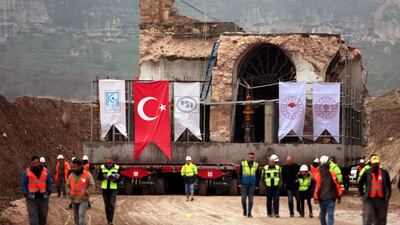 epa08077077 The 15th century Er Rizk Mosque is transported from the town of Hasankeyf, where a hydropower project is schedualed to flood the area, in Batman province, Turkey 16 December 2019 (issued 17 December 2019). Turkey’s second-largest Ilısu hydroelectric dam project is being filled with the Tigris River despite protests. A 300-square-kilometer lake will be created by the 1820-meter long, 135-meter high Ilisu dam, which will flood the archeologically important city of Hasankeyf. EPA/STR