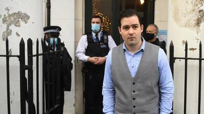 Police speak with Pastor Regan King after he attempted to hold a baptism at the Angel Church in north London, Britain, during the UK's lockdown. EPA