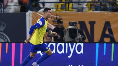 Al Nassr's Cristiano Ronaldo runs with the ball against Al Batin. AFP