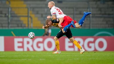Christoph Daferner of Dynamo Dresden is challenged by Toni Leistner of Hamburg. Getty