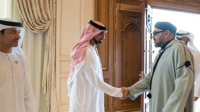 Sheikh Ammar bin Humaid, Crown Prince of Ajman, greets King Mohammed VI. Seen with Sheikh Hazza bin Zayed, Vice Chairman of the Abu Dhabi Executive Council, left. Mohammed Al Hammadi / Crown Prince Court - Abu Dhabi