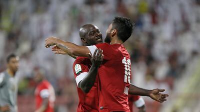 Luis Antonio Jiminez celebrates his goal with Grafite. Mike Young / The National