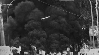 Smoke rises in a Beirut street during clashes between Palestinians and members of Christian militia the Lebanese Forces, backed by Lebanon's Christian Kataeb Phalangist party, on April 15, 1975. AFP