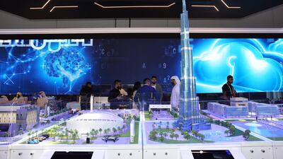 Visitors to the UAE Cyber Security Council at the Gitex Global technology exhibition in Dubai on Monday. A majority of senior executives in the UAE said they trust the effectiveness of AI in dealing with cyber threats, a report from Palo Alto Networks shows. Pawan Singh / The National