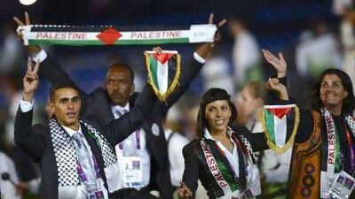 Members of the Palestinian team parade during the opening ceremony of the London 2012 Olympic Games.