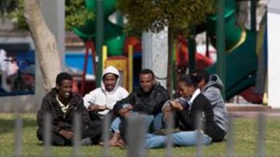 African immigrants wait to see if they will be picked up as workers, in Levinsky Park in Tel Aviv.