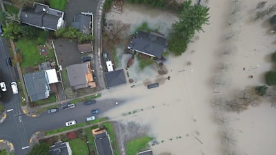 The Snoqualmie River floods over its banks at Riverview Park in Snoqualmie, Wash. AP