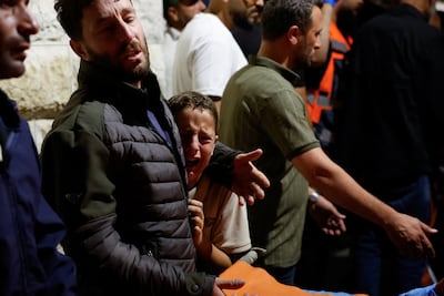 Palestinians mourn those killed in a shootin at the West Bank village of Tell. Reuters