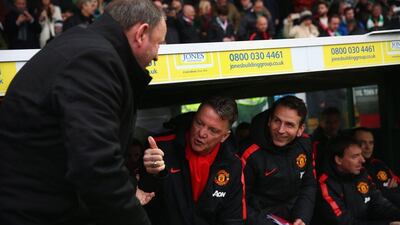 Manchester United manager Louis van Gaal greets Yeovil Town manager Gary Johnson, left, before their FA Cup third round match on Sunday, which United won. Michael Steele / Getty Images / January 4, 2015