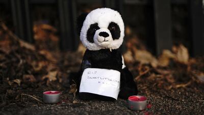 A tribute left near the scene of the fatal house fire. PA