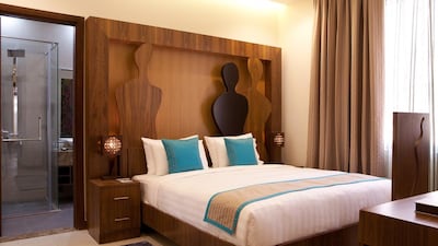 Najat Maky's female forms are depicted here on the bedhead of one of the rooms in Noon Art Hotel Apartments. Courtesy: Noon Hotel Apartments