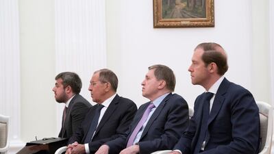 Sergey Lavrov, Minister of Foreign Affairs of Russia (third right) and Denis Manturov, Minister of Industry and Trade of Russia (right), attend a meeting with Vladimir Putin, President of Russia (not shown), at the Kremlin. Mohamed Al Hammadi / Crown Prince Court - Abu Dhabi