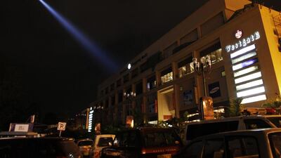 A police helicopter hovers over the Westgate mall in search of suspects. Dai Kurokawa / EPA