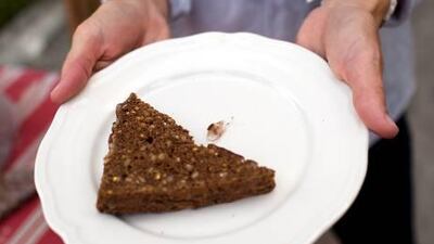 A mother holds a piece of bread with a 2.5cm shard of glass that her son bit into yesterday.
