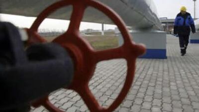 A Gazprom worker walks next to pipelines at a gas measuring station at the Russian-Ukrainian border in Sudzha near Kursk, some 500km south of Moscow.