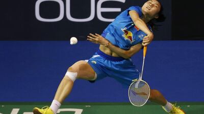 China's Wang Yihan smashes against compatriot Han Li during their women's singles semi-finals match at the Singapore Open badminton tournament. Edgar Su / Reuters