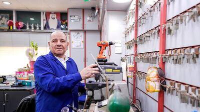 Abu Yousef, whose plastic chairs serve as meeting spots, is a fixture of Al Nahyan district. Victor Besa / The National