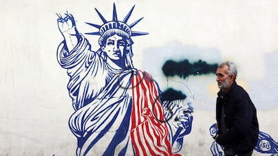 A mural depicting the US Statue of Liberty, with the torch-bearing arm broken, painted on the outer walls of the former US embassy in Tehran. AFP