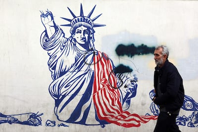 A mural depicting the US Statue of Liberty, with the torch-bearing arm broken, painted on the former US embassy in Tehran. AFP