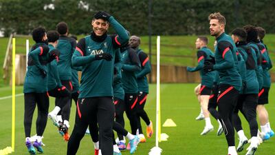 Liverpool's Virgil van Dijk, left, and Jordan Henderson during training. PA