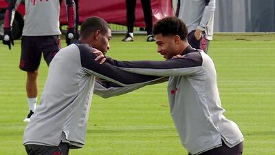 Bayern Munich's David Alaba, left, and Serge Gnabry during a training session. EPA