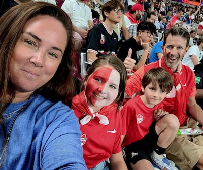 Jay French, an ex-professional football player, watches the Canada v Croatia match on Sunday night in Doha with his family - Kirrily French, Taylor French, aged 10, and Kingsley French, aged seven. Photo: French family