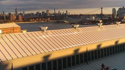 Workers repairing a roof at the Brooklyn Naval Yard, New York. Photo : John S Moller