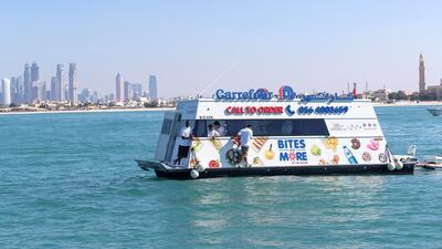 Dubai resident Marie Byrne takes her yacht out to try the new Carrefour floating shop. Antonie Robertson / The National