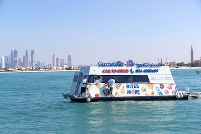 Dubai resident Marie Byrne takes her yacht out to try the new Carrefour floating shop. Antonie Robertson / The National