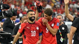 Mohamed Salah, left, celebrates with Hamza Abdelkarim celebrate after Egypt's penalty shoot-out win over Australia. Reuters