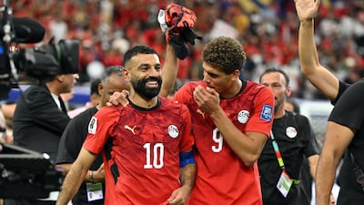 Mohamed Salah, left, celebrates with Hamza Abdelkarim celebrate after Egypt's penalty shoot-out win over Australia. Reuters