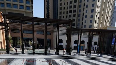 Hesham Senih is photographed with the printed 3D art work of artist Kurt Wenner. Pawan Singh / The National