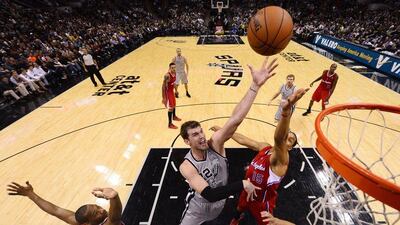 Tiago Splitter makes a basket for San Antonio during Saturday's win over the Los Angeles Clippers. Larry W Smith / EPA