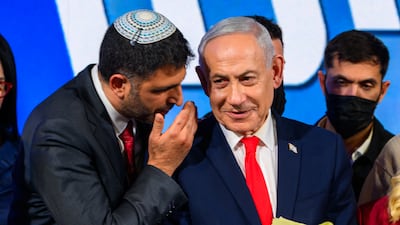 JERUSALEM, ISRAEL - OCTOBER 28: Dr. Shlomo Karhi (L), Minister of Communications, whispers something to Israeli Prime Minister and Likud party leader Benjamin Netanyahu at the Likud Party election-night event at the Teddy Hall, International Convention Center on October 28, 2026 in Jerusalem, Israel. Votes are being counted to elect 120 members of the Knesset, which will determine the make-up of the government that succeeds incumbent Prime Minister Benjamin Netanyahu's right-wing coalition. The legislative elections were the first to be held since the Hamas-led attacks against Israel on October 7, 2023. (Photo by Alexi J. Rosenfeld / Getty Images)